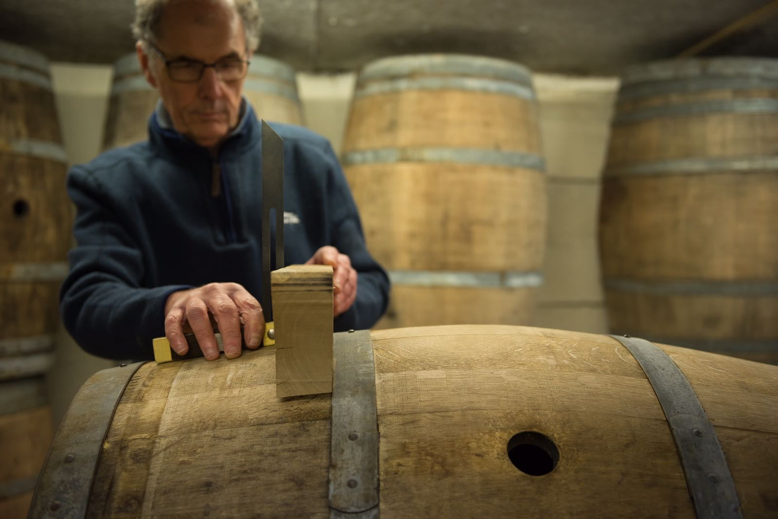 carpenter working on barrel furniture - oak guys