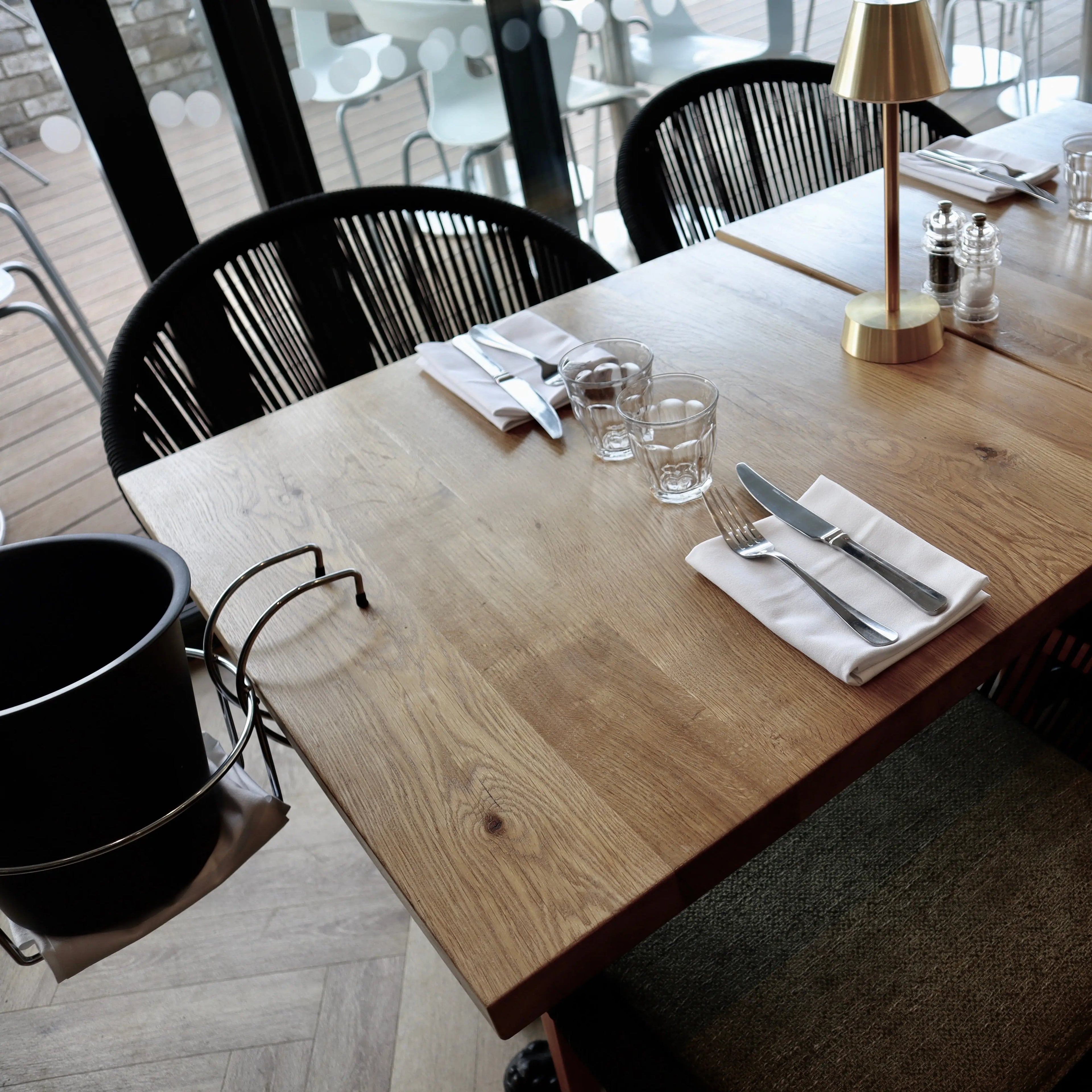 Square restaurant table with glasses on top