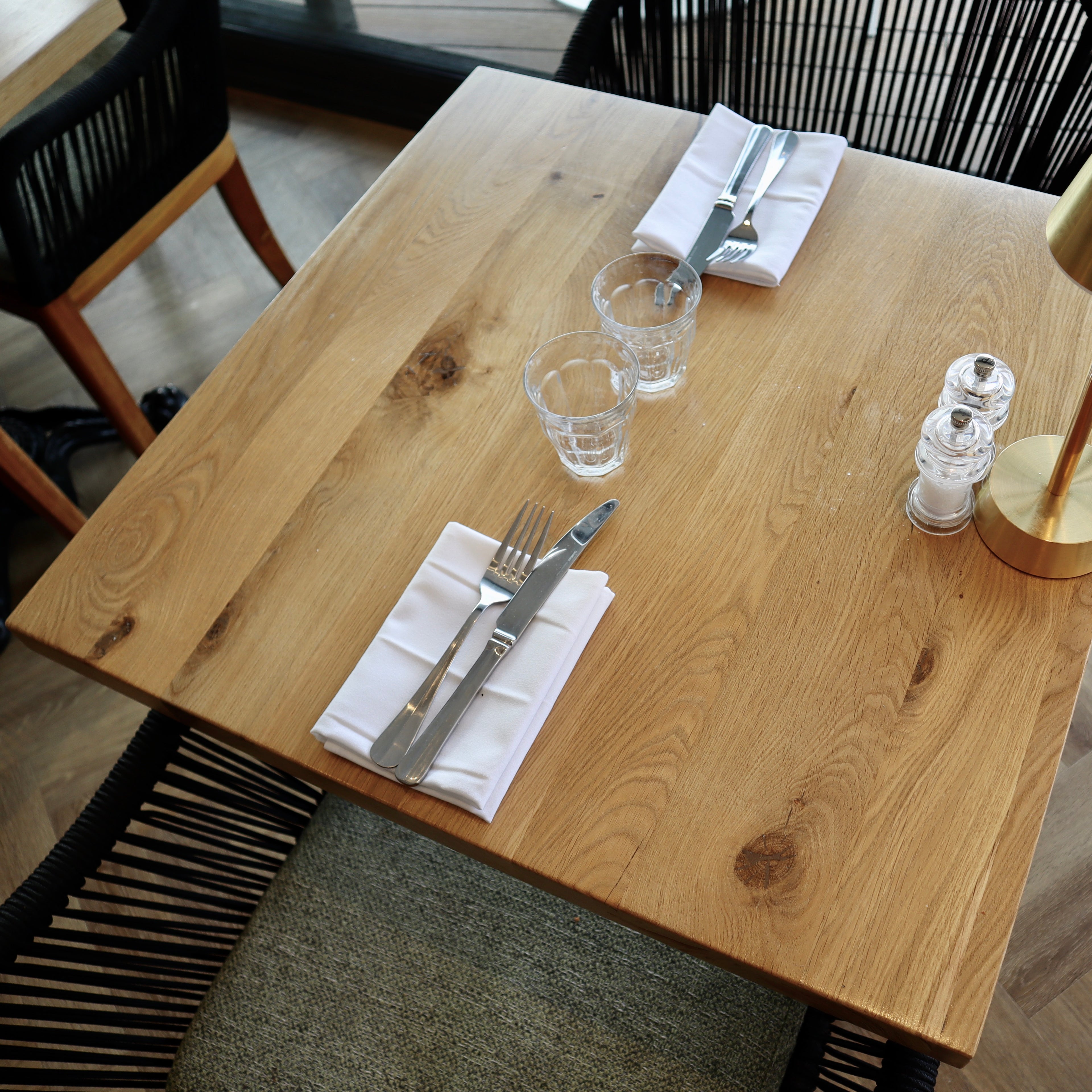 Square restaurant table with cutlery