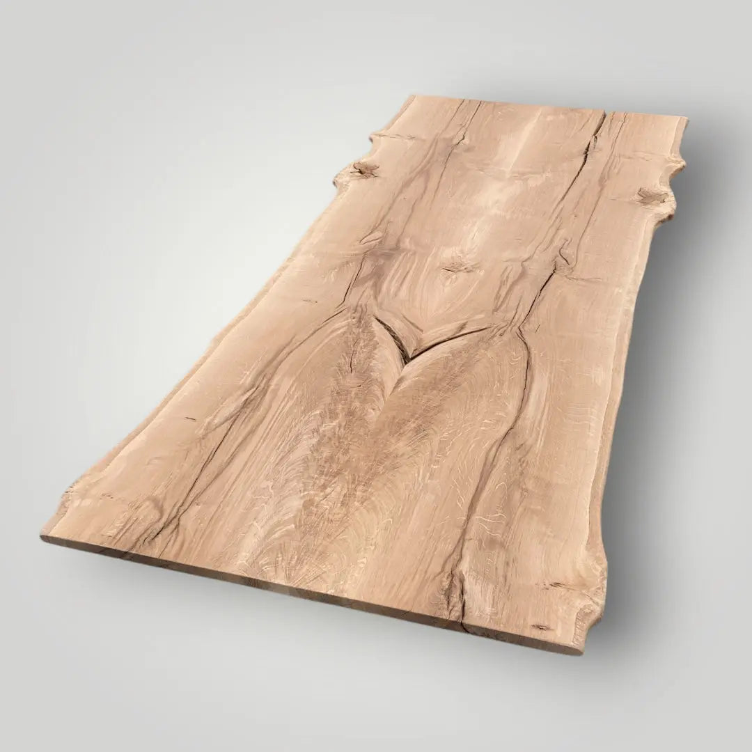 Wooden table top with a natural grain pattern on a light gray background -