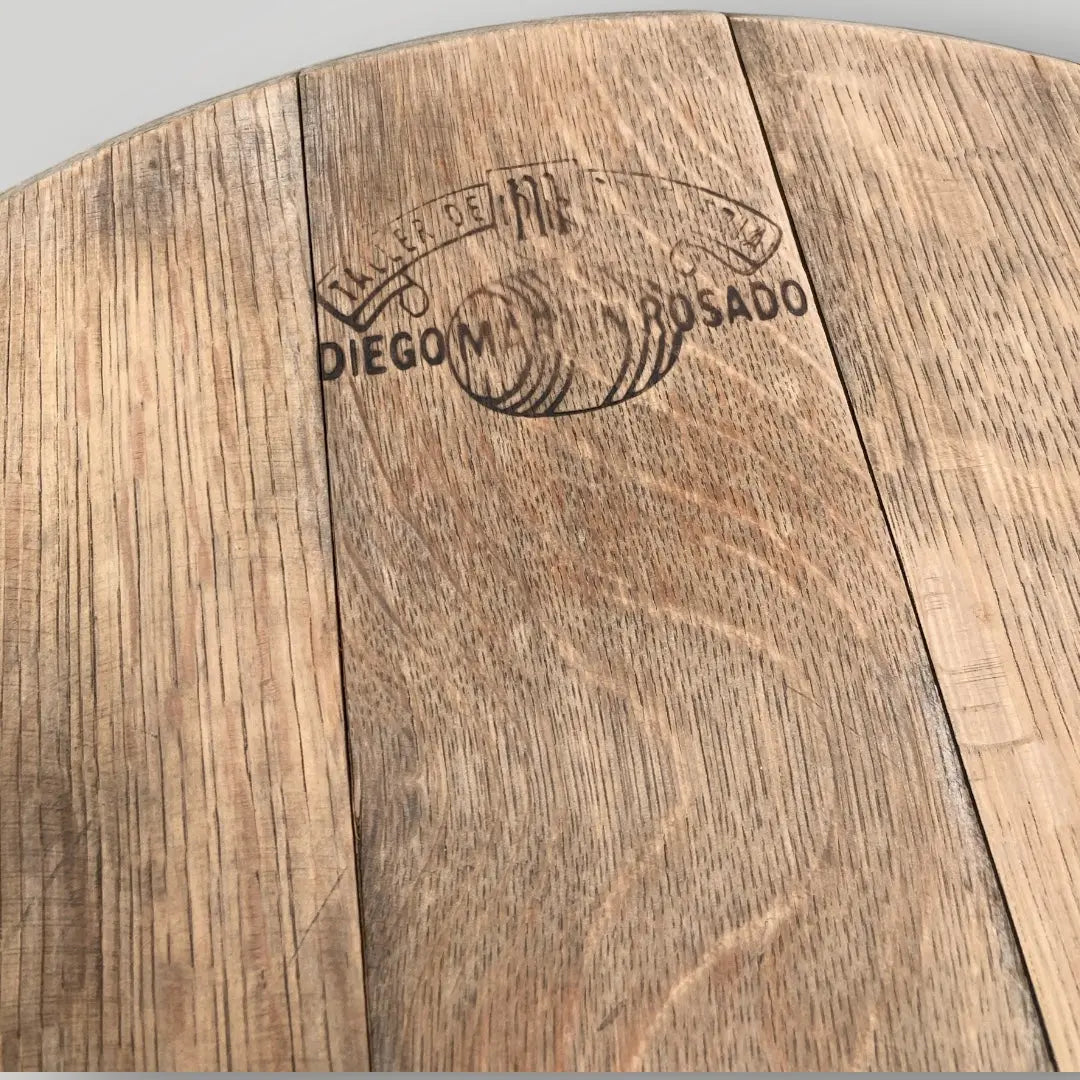 Wooden surface with a engraved logo and text