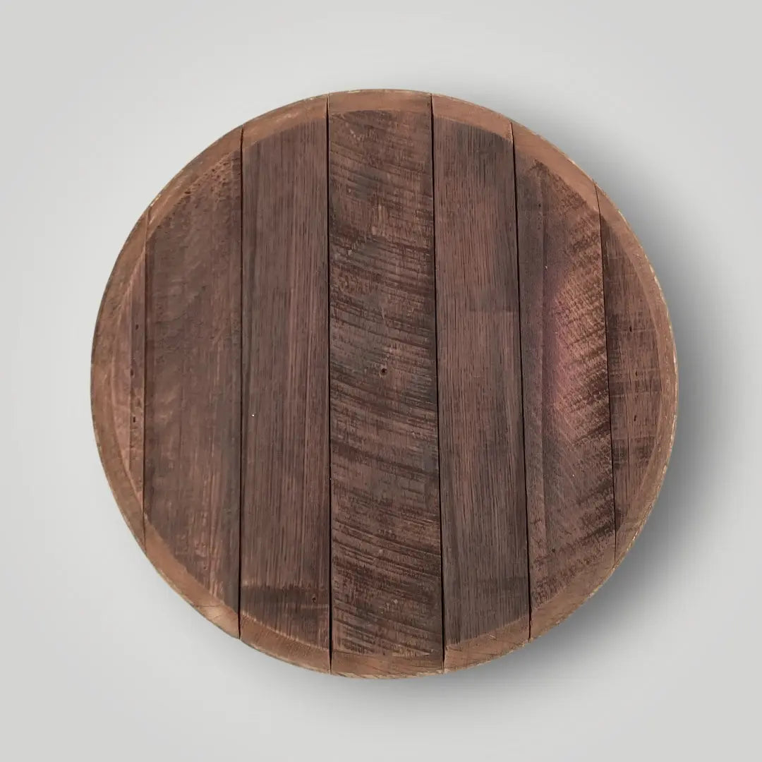 Round wooden cutting board on a light gray background