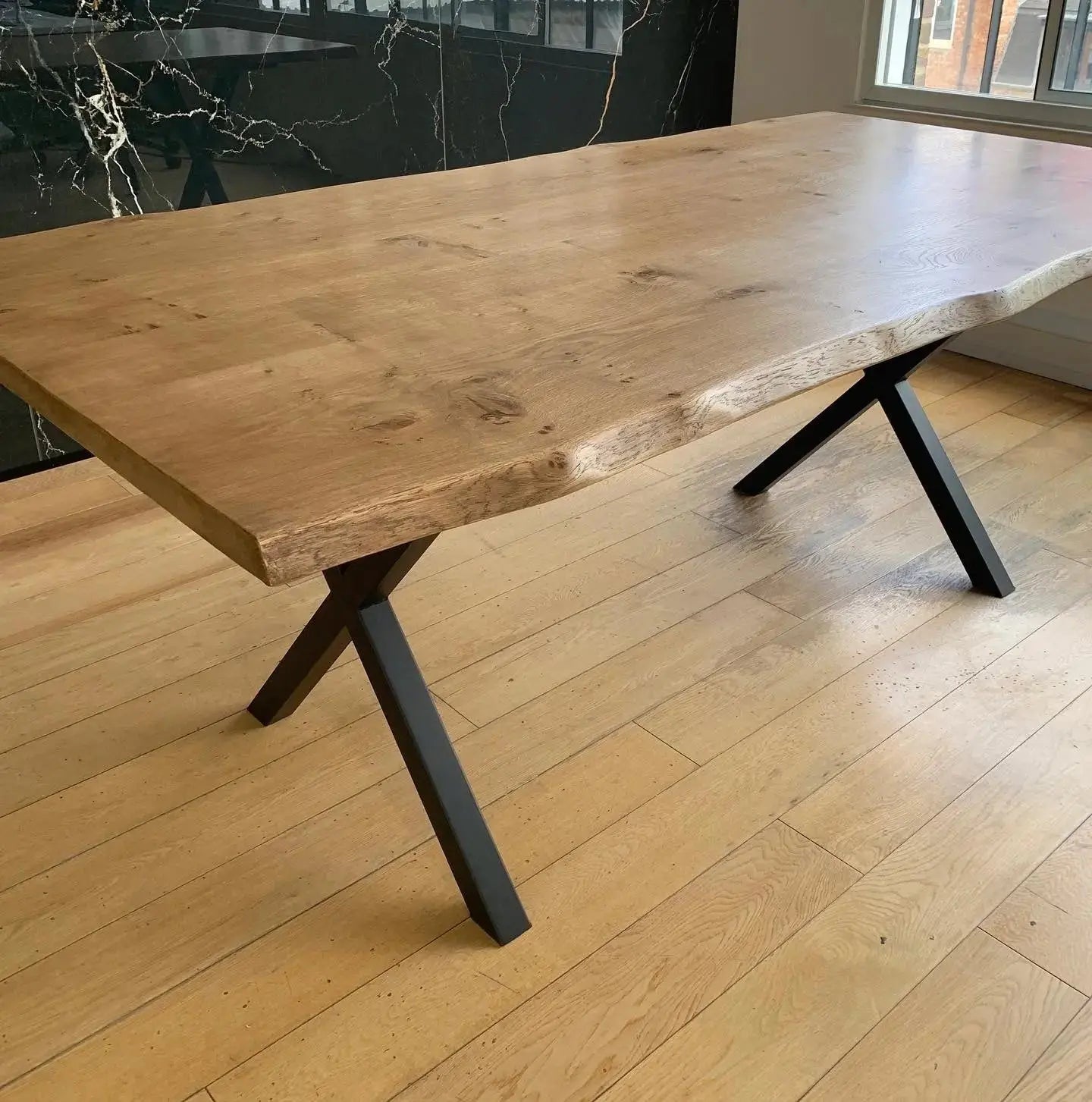 solid Oak table top waney edge cross metal legs