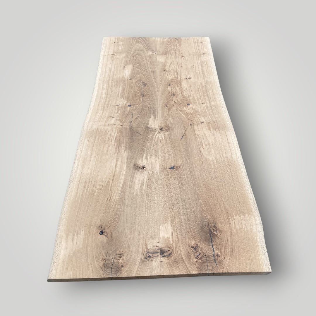 Wooden slab with natural grain pattern on a gray background