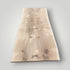 Wooden slab with natural grain pattern on a gray background