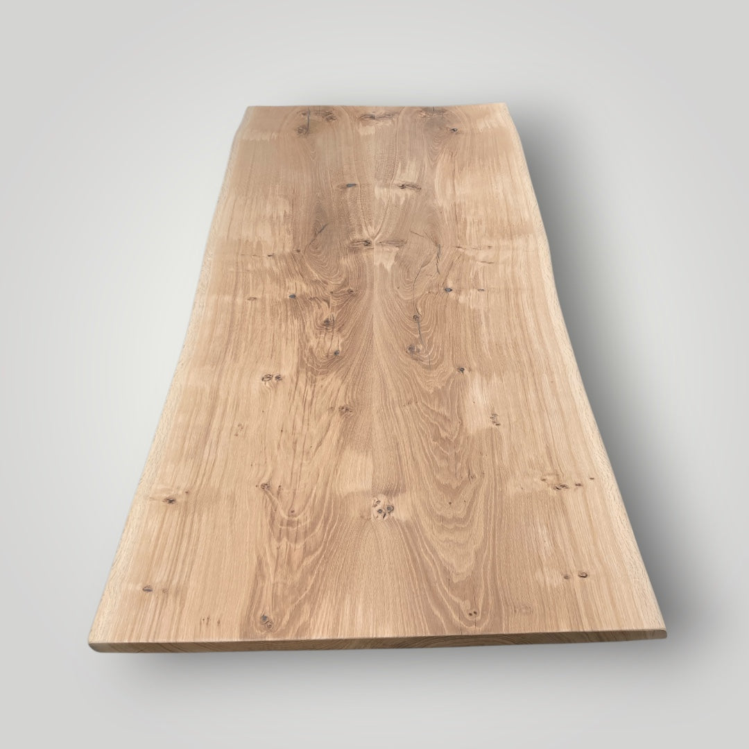 Rectangular wooden table top on a gray background