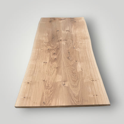 Rectangular wooden table top on a gray background