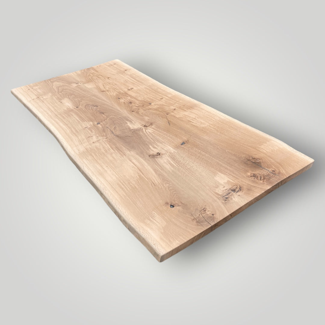 Wooden cutting board on a light gray background