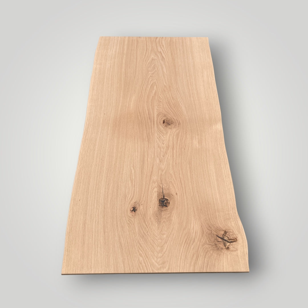 Rectangular wooden board with a natural finish on a gray background