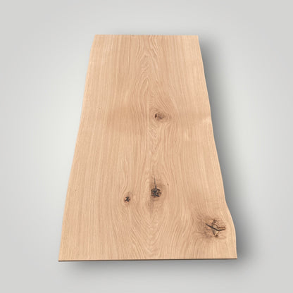 Rectangular wooden board with a natural finish on a gray background