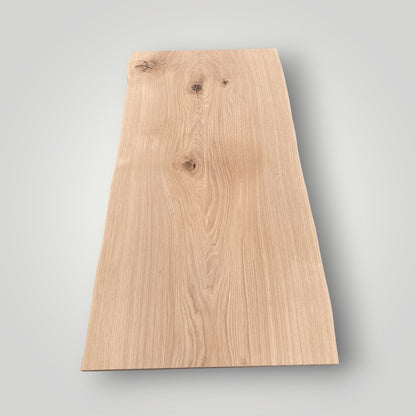 Plain wooden board on a gray background