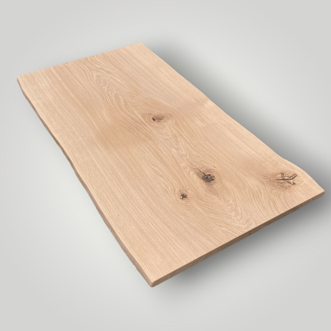 Wooden cutting board on a light gray background
