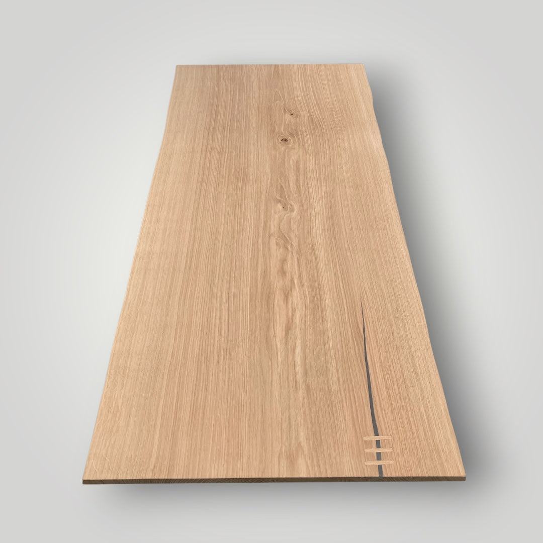 Wooden panel with a visible grain on a gray background
