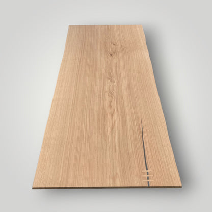 Wooden panel with a visible grain on a gray background