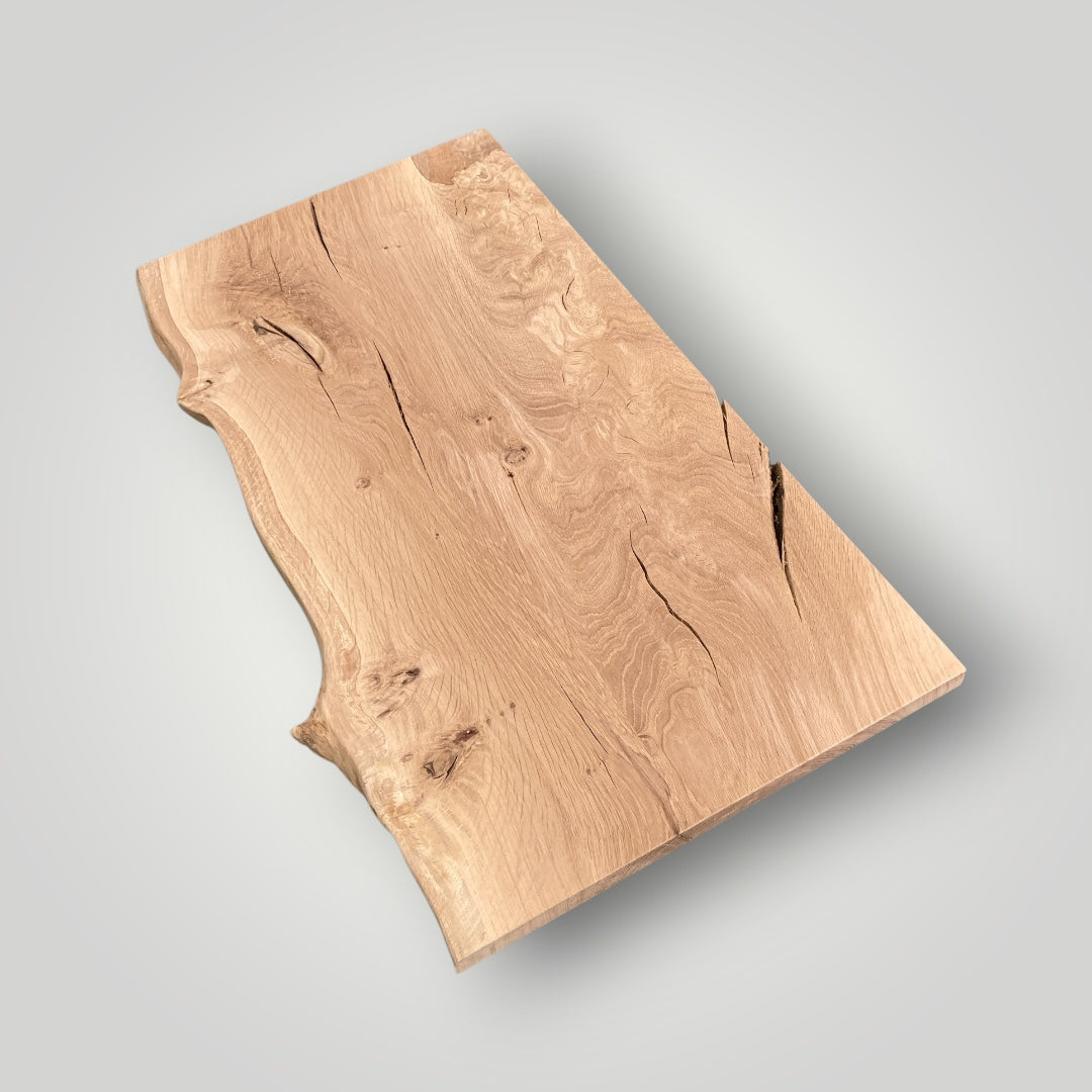 Wooden cutting board with a natural finish on a gray background
