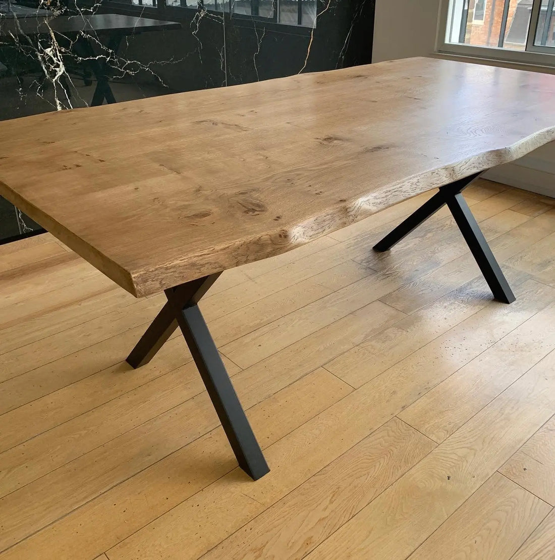 solid Oak table top waney edge cross metal legs
